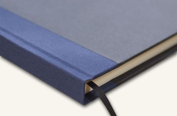 Writing and notebook black, with marine blue linen